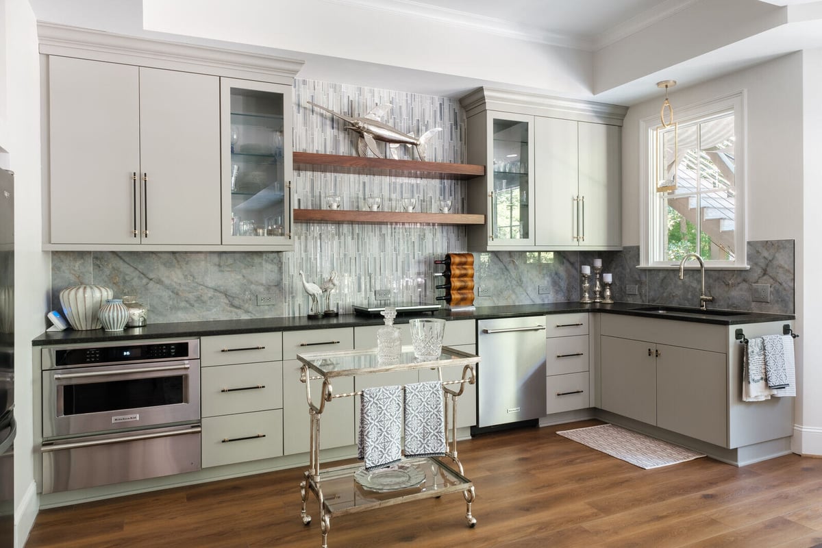 Sleek bar area with gray cabinetry in a custom home by Wolfe Homes, Greensboro, NC