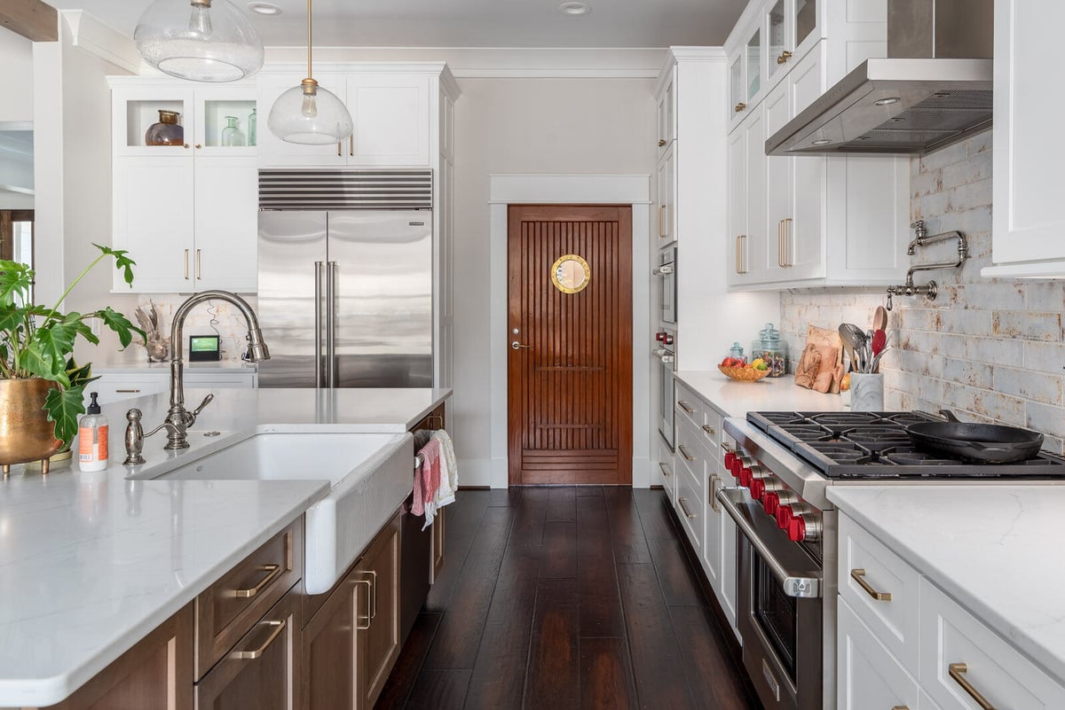 Wolfe Homes’ custom kitchen remodel in Greensboro, NC, featuring high-end appliances and polished countertops