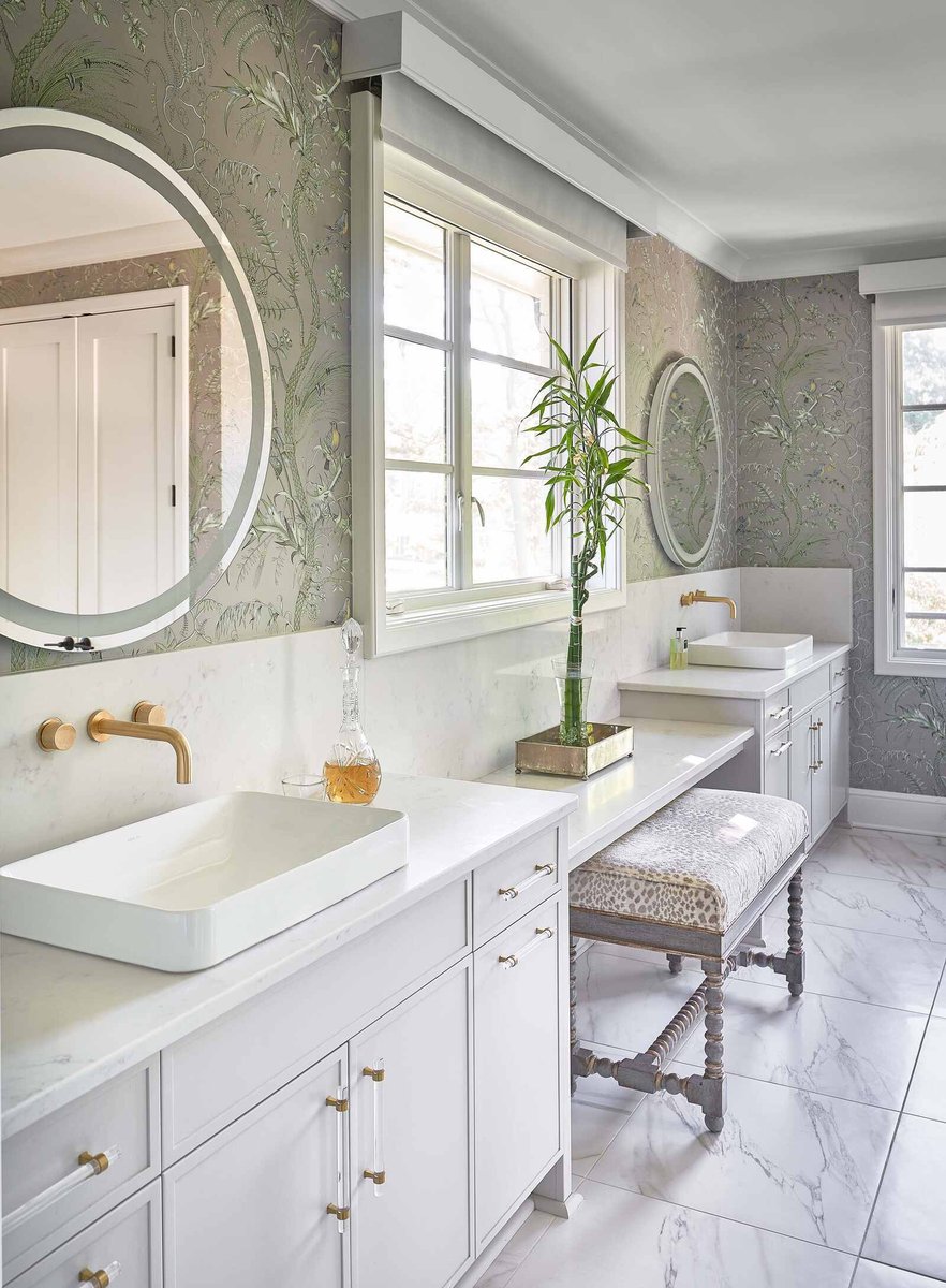 Contemporary bathroom with double vanity and gold fixtures