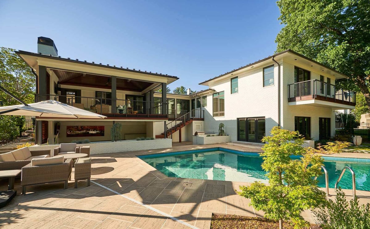 Luxurious backyard with modern patio seating and swimming pool