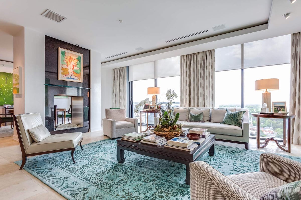 Bright and cozy living room with floor-to-ceiling windows in a custom home by Wolfe Homes, Greensboro, NC