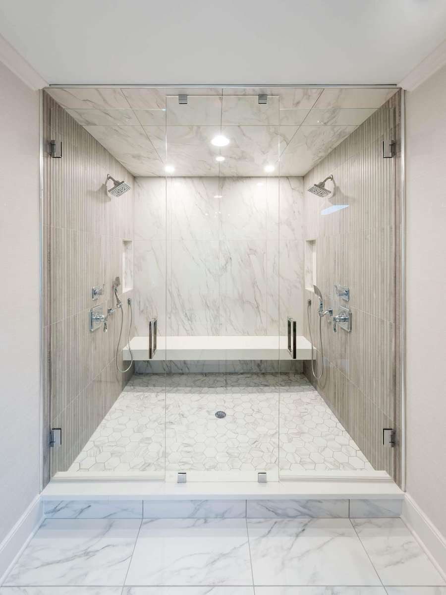 Luxurious glass shower in a custom Greensboro bathroom remodel by Wolfe Homes