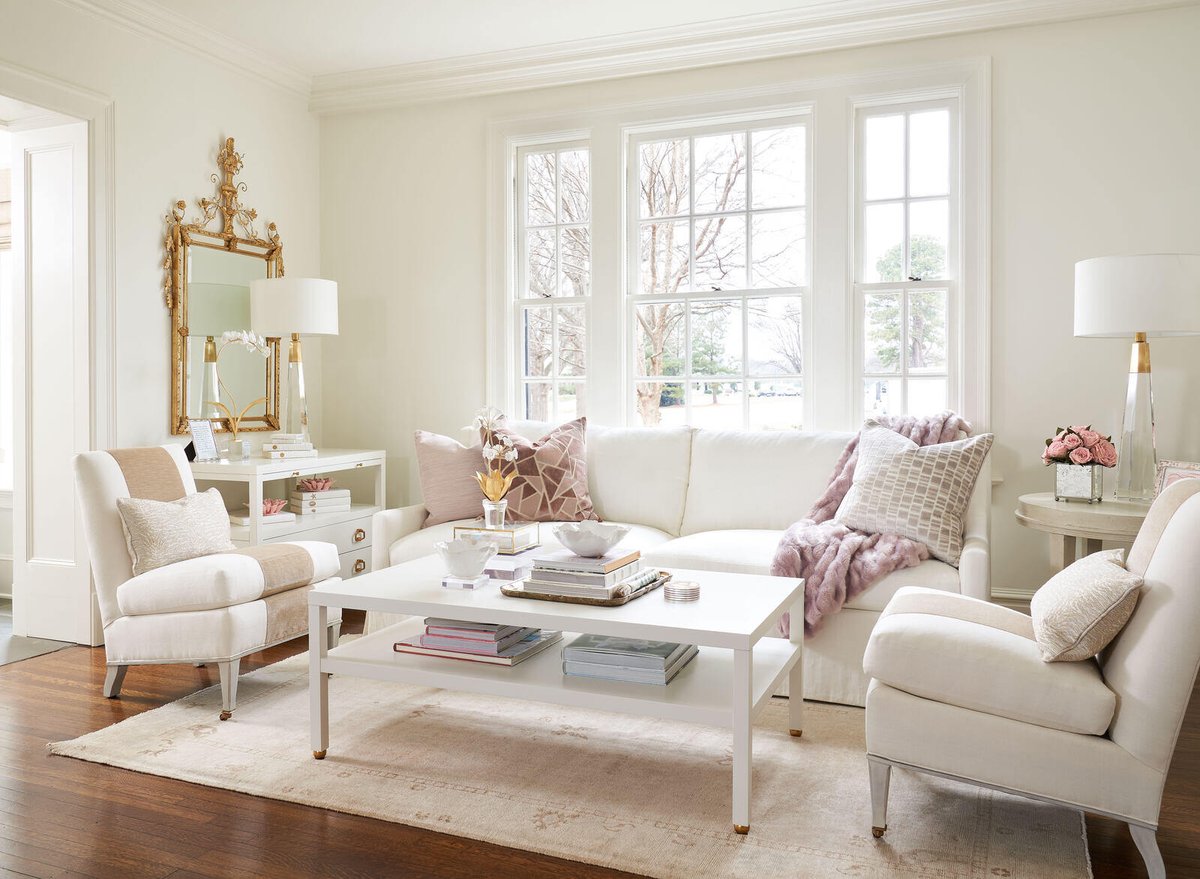 Bright and airy living room with white decor in a Greensboro remodel by Wolfe Homes