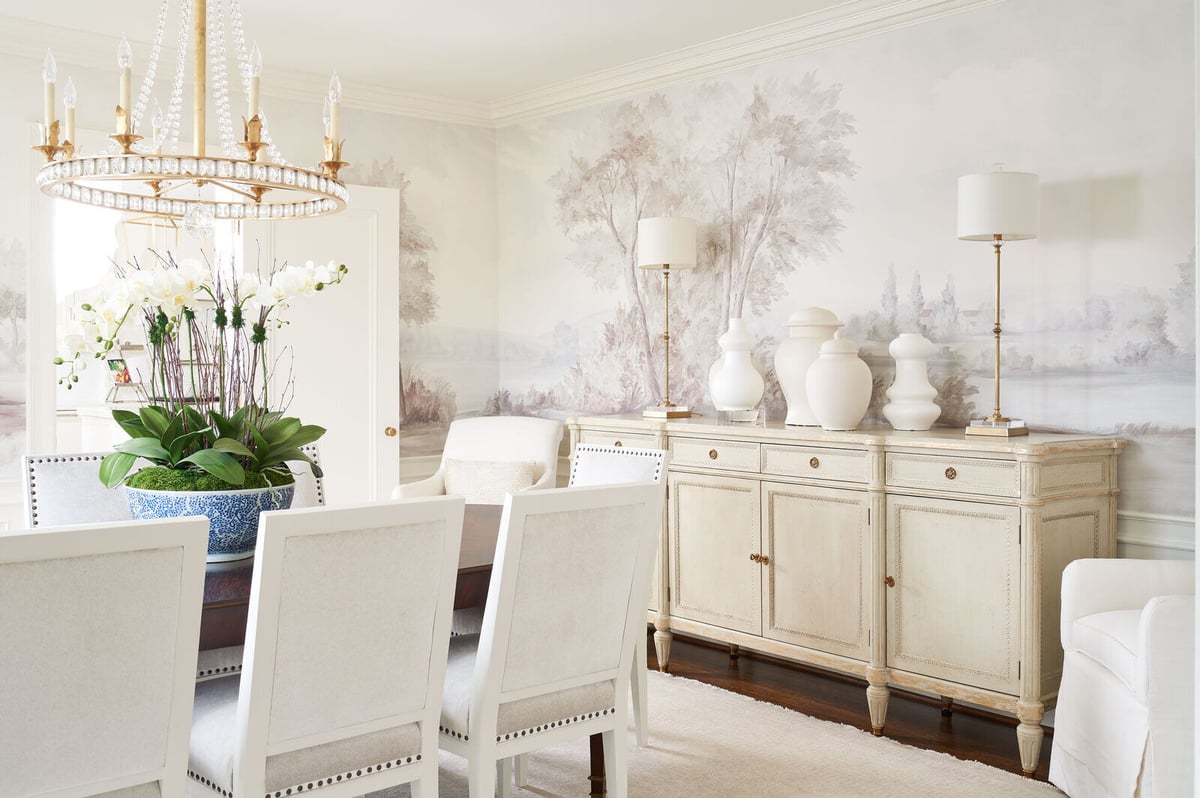 Elegant dining room with crystal chandelier and floral centerpiece in a custom remodel by Wolfe Homes, Greensboro, NC