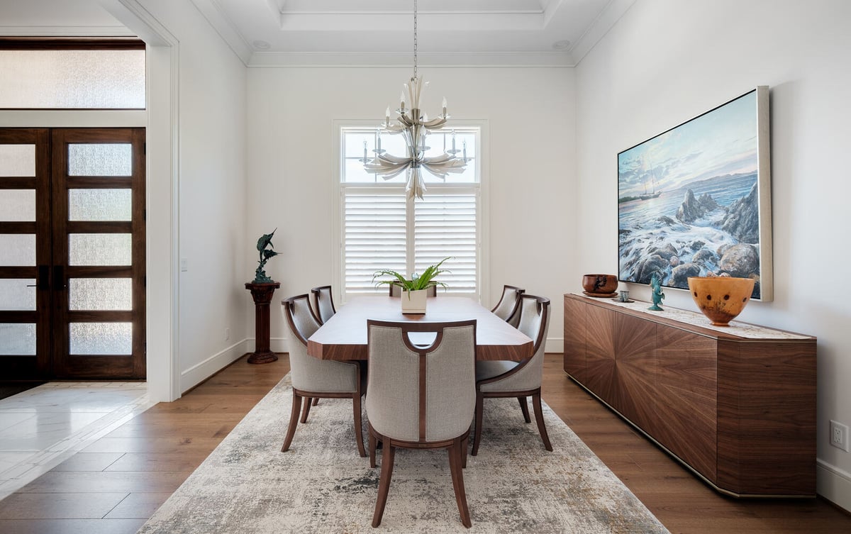 Elegant dining room with contemporary chandelier in a Greensboro custom home by Wolfe Homes