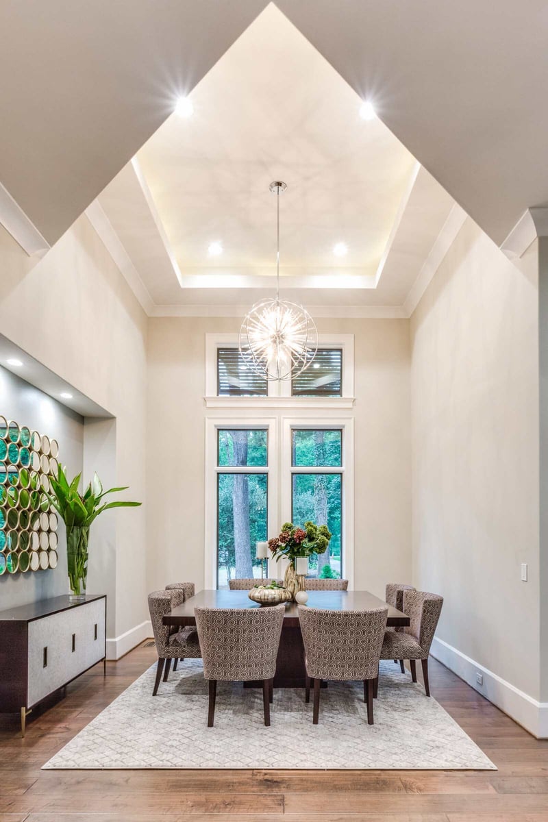 Elegant dining room with unique ceiling design in Greensboro custom home by Wolfe Homes