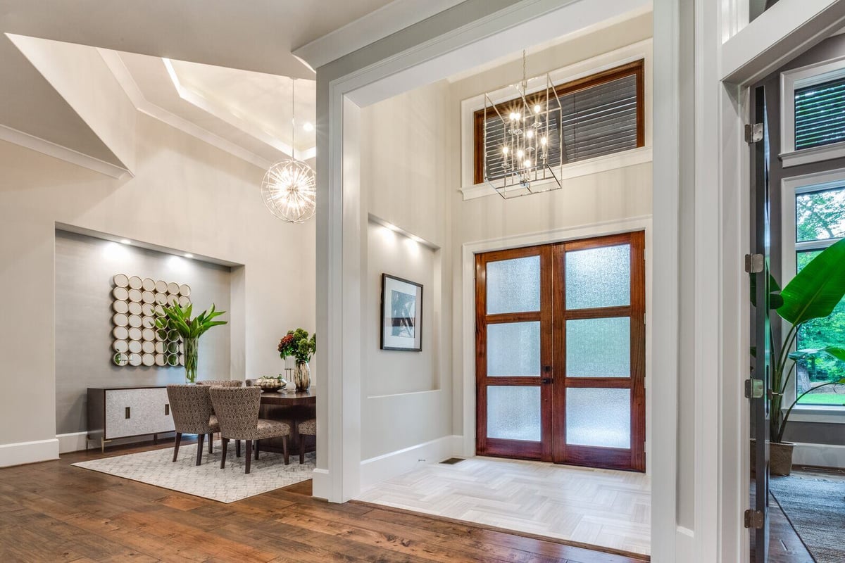 Elegant entryway and dining area in Greensboro custom home by Wolfe Homes