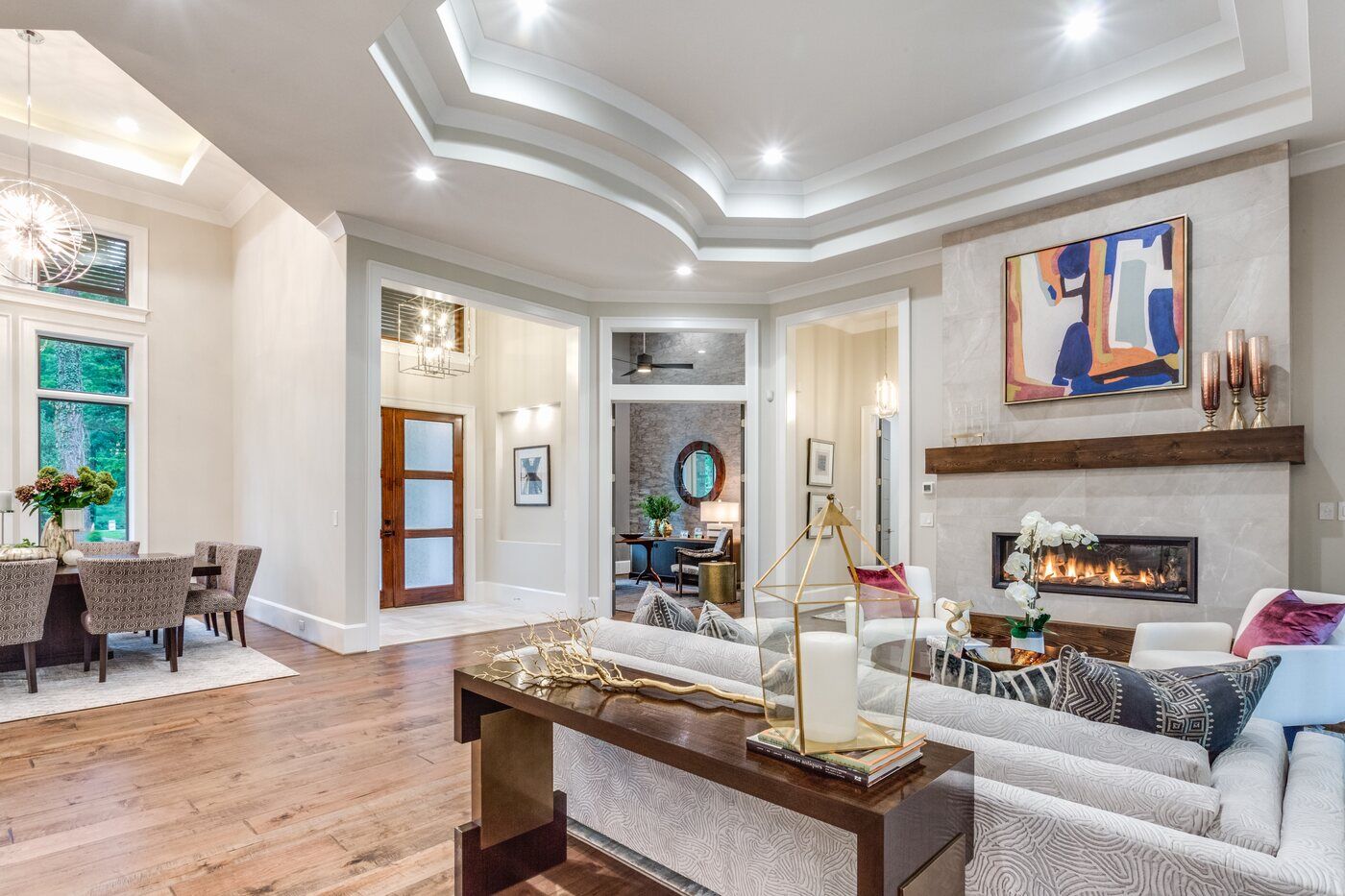 Open-concept living room in Greensboro custom home by Wolfe Homes, featuring a modern fireplace and stylish decor Open-concept living room in Greensboro custom home by Wolfe Homes, featuring a modern fireplace and stylish decor